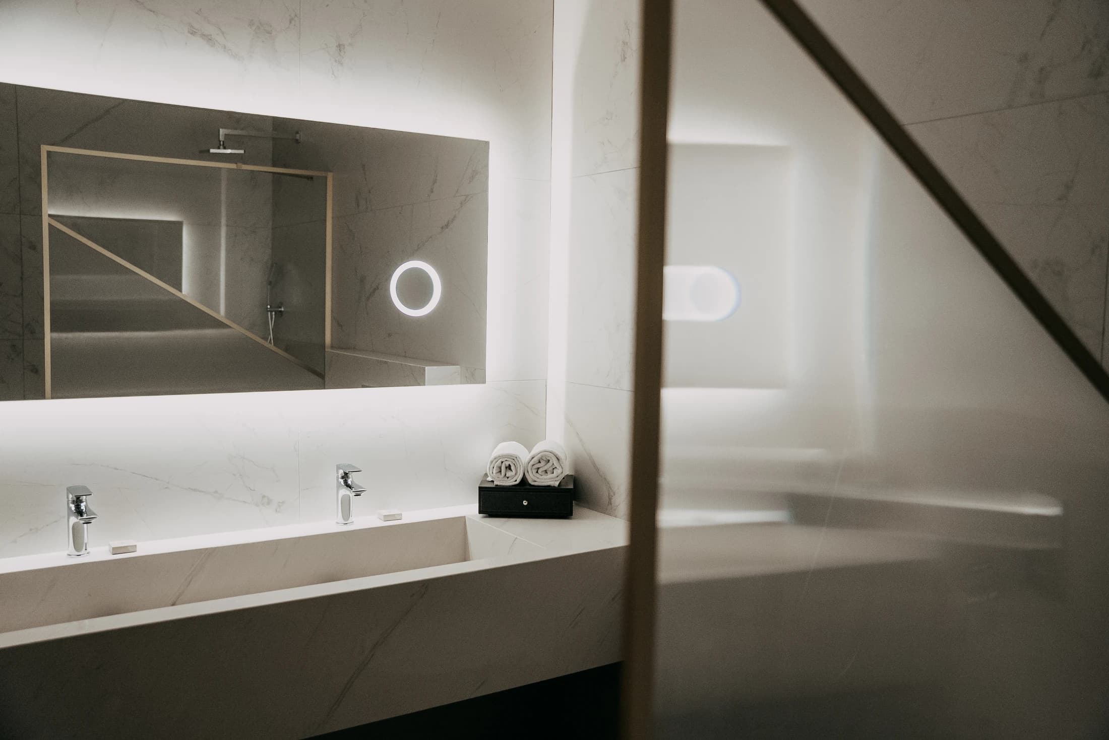 Bathroom vanity with lit mirror